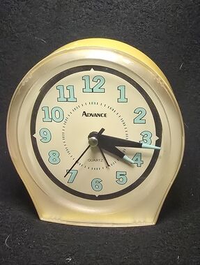 Advance Yellow Clock with Aqua Numerals